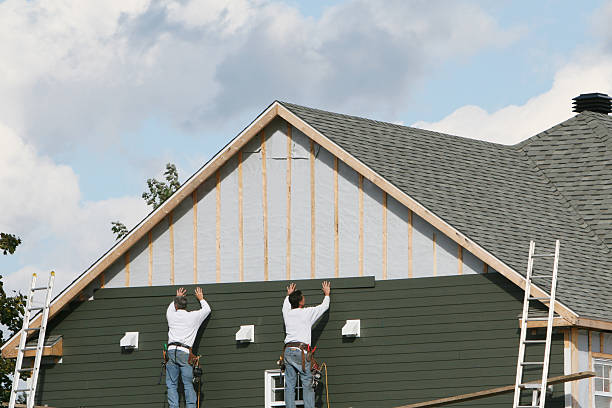 Professional Storm Damage Siding Repair technician working in Tallmadge, OH
